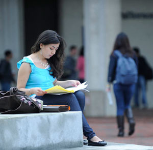 A student studying outside